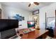 Home office featuring laminate flooring, ceiling fan, and large desk at 741 Canary Wharf Dr, Las Vegas, NV 89178