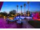 Inviting outdoor oasis featuring a large swimming pool with rock features and swaying palm trees, perfect for relaxation and entertainment at 741 Canary Wharf Dr, Las Vegas, NV 89178