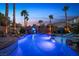 Private pool area with custom rock waterfall feature and lush landscaping, perfect for relaxation and entertainment at 741 Canary Wharf Dr, Las Vegas, NV 89178