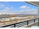 Enjoy the beautiful city view from this home's private balcony with black metal railing and desert landscaping at 752 Echelon St, Las Vegas, NV 89138