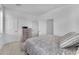 Bright bedroom featuring neutral walls, a comfy queen bed, and a chest of drawers for added storage at 752 Echelon St, Las Vegas, NV 89138