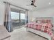 Comfortable bedroom boasts a cozy bed, sliding glass doors to a balcony, and views at 752 Echelon St, Las Vegas, NV 89138