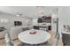 This area features a stylish marble dining table with modern kitchen and living room views at 752 Echelon St, Las Vegas, NV 89138