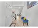 Bright hallway with high ceilings, wood floors, and a cozy blue bench, creating a welcoming atmosphere at 752 Echelon St, Las Vegas, NV 89138