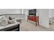 Upstairs bonus living room with comfortable gray sectional, accent pillows, and TV on wooden stand at 752 Echelon St, Las Vegas, NV 89138