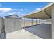 Covered patio area with storage shed and ample space at 808 Vermillion Dr, Henderson, NV 89002