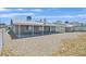 Spacious backyard with a covered patio and low-maintenance landscaping at 808 Vermillion Dr, Henderson, NV 89002