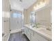Bathroom featuring a double sink vanity and a glass enclosed shower at 808 Vermillion Dr, Henderson, NV 89002