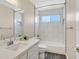 Bathroom featuring a tub shower combo, a mirror, and an updated vanity at 808 Vermillion Dr, Henderson, NV 89002