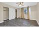 Cozy bedroom with a ceiling fan, window, and closet space at 808 Vermillion Dr, Henderson, NV 89002