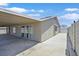 Back exterior view highlighting the covered patio and sliding glass door at 808 Vermillion Dr, Henderson, NV 89002