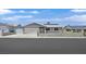 Charming single-story home featuring a two car garage, well-maintained landscaping, and solar panels at 808 Vermillion Dr, Henderson, NV 89002