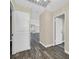 Bright hallway featuring wood floors and access to multiple rooms at 808 Vermillion Dr, Henderson, NV 89002