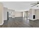Open-concept living space with stylish wood floors, a charming fireplace, and seamless flow to the kitchen at 808 Vermillion Dr, Henderson, NV 89002