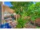 Enjoy the shaded patio with mature trees in the private backyard at 8316 Accolade St, Las Vegas, NV 89139