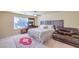 Well-lit bedroom offers carpeted floor, a ceiling fan, and ample space, creating a comfortable and inviting atmosphere at 8316 Accolade St, Las Vegas, NV 89139