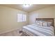 Bright bedroom featuring a window, closet, and a comfortable bed with stylish pillows at 8316 Accolade St, Las Vegas, NV 89139