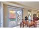 Cozy dining area with sliding glass doors leading to the outdoor patio at 8316 Accolade St, Las Vegas, NV 89139