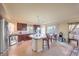 Open-concept kitchen with stainless steel appliances and a view of the patio through sliding doors at 8316 Accolade St, Las Vegas, NV 89139