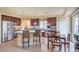Bright kitchen with a breakfast bar, stainless steel appliances, and tile flooring at 8316 Accolade St, Las Vegas, NV 89139