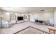 Bright space featuring a seating area, TV, and shelving units with natural light at 8316 Accolade St, Las Vegas, NV 89139