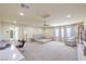 Spacious main bedroom with sitting area, fan, and multiple windows for ample light at 8316 Accolade St, Las Vegas, NV 89139