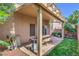Covered patio featuring a table with bench seating perfect for outdoor relaxing at 8316 Accolade St, Las Vegas, NV 89139