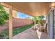 Cozy covered patio with dining table, perfect for outdoor entertaining and relaxation at 8316 Accolade St, Las Vegas, NV 89139