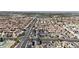 Expansive aerial view of a well-planned community featuring numerous homes and convenient access to major roads at 8436 Noir Ave, Las Vegas, NV 89129