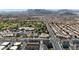 Panoramic aerial view of a neighborhood near Durango Hills park and golf course with mountain views at 8436 Noir Ave, Las Vegas, NV 89129