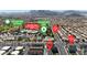 Panoramic aerial view of a neighborhood near Durango Hills park and golf course with mountain views at 8436 Noir Ave, Las Vegas, NV 89129