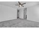 Spacious, carpeted bedroom with ceiling fan and ensuite bathroom at 8436 Noir Ave, Las Vegas, NV 89129