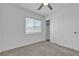 Comfortable carpeted bedroom with a window and a closet for storage at 8436 Noir Ave, Las Vegas, NV 89129