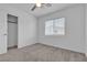 Bedroom featuring carpeted floors, a ceiling fan, and a window with blinds at 8436 Noir Ave, Las Vegas, NV 89129
