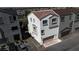 Aerial view of new townhome community featuring attached garages and modern facade at 8436 Noir Ave, Las Vegas, NV 89129