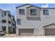 Charming townhome with attached garage, multi-paned windows, and neutral stucco at 8436 Noir Ave, Las Vegas, NV 89129