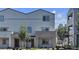 A charming townhome featuring a covered entryway, neutral stucco, and well-maintained landscaping at 8436 Noir Ave, Las Vegas, NV 89129