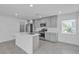 Well-lit kitchen with stainless steel appliances, center island, and modern gray cabinets at 8436 Noir Ave, Las Vegas, NV 89129