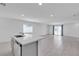 Bright, open-concept kitchen and living area with modern island and stainless-steel appliances at 8436 Noir Ave, Las Vegas, NV 89129