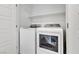 Well-lit laundry room featuring modern washer and dryer at 8436 Noir Ave, Las Vegas, NV 89129