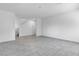 Bright, open-concept living room with tile floors and fresh neutral paint at 8436 Noir Ave, Las Vegas, NV 89129