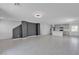 Open-concept living space with modern kitchen, tile flooring, and recessed lighting at 8436 Noir Ave, Las Vegas, NV 89129