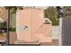 Drone shot of house with desert landscaping, lawn, and putting green at 849 Ringwood Ln, Las Vegas, NV 89110