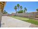 A large backyard featuring artificial turf, a concrete patio and block wall at 849 Ringwood Ln, Las Vegas, NV 89110