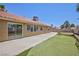 Backyard with artificial turf and patio, perfect for entertaining at 849 Ringwood Ln, Las Vegas, NV 89110