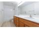 Bathroom with a double sink vanity, a mirror, and a shower/tub combo at 849 Ringwood Ln, Las Vegas, NV 89110
