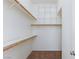 Walk-in closet with installed shelving and carpeted floors at 849 Ringwood Ln, Las Vegas, NV 89110