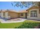 Charming house with a two car garage, desert landscaping, and artificial lawn at 849 Ringwood Ln, Las Vegas, NV 89110