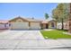 Charming single-story home with a well-manicured lawn, a two car garage, and a tile roof at 849 Ringwood Ln, Las Vegas, NV 89110