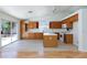 Bright kitchen with white countertops and wood cabinets, and backyard access at 849 Ringwood Ln, Las Vegas, NV 89110